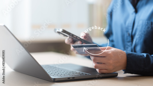 A person checking a credit card using a smartphone with a chargeback icon, highlighting minimum payment issues, overdue alerts, and financial risks. Minimum payment warning