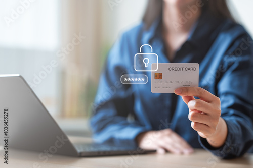 A person holding a credit card with security icons displayed, representing secure digital payments, fraud prevention, and protected online transactions in a modern financial environment. Card freeze