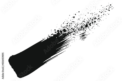 Abstract black brush stroke dissolving into scattered particles on a white background