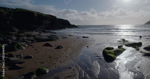 Enjoying the beauty of the coast in the Kerry region during a trip to Ireland with views of the waves and rocks
