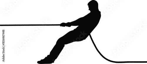 Silhouette of a man pulling a rope in a strong tug of war competition