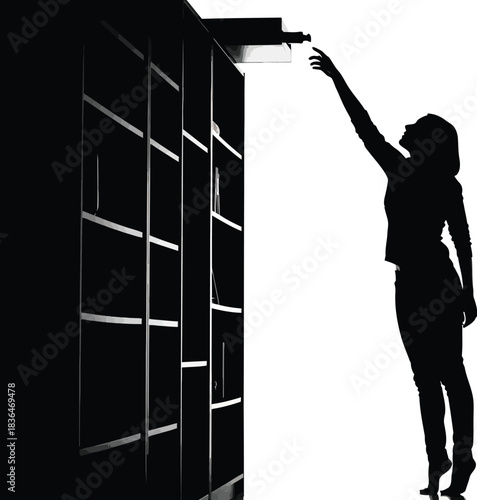 Silhouette of a woman reaching up to select a book from a tall bookshelf in a high contrast black and image