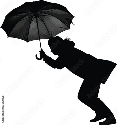 Silhouette of a person struggling to hold an open umbrella against strong wind