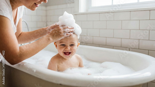 Mother washing baby bath foam copy space hygiene care family bathtub mom child bubbles playing water clean bathroom happiness routine washing hair parenting love tenderness close up portrait skin