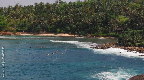 Aerial View of Surfers in the Ocean at Hiriketiya, Sri Lanka