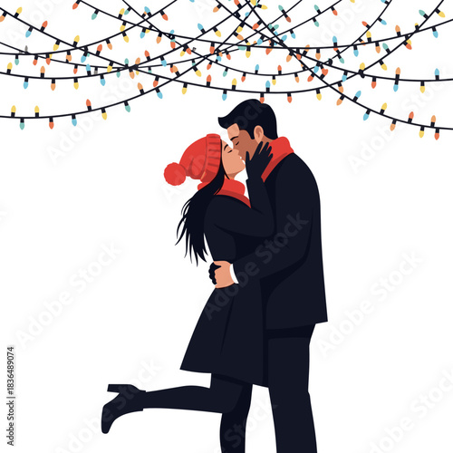 Couple kissing under colorful lights during winter holiday season  