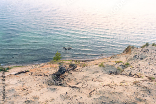 Fototapeta Naklejka Na Ścianę i Meble -  Blue morning light over the Baltic coast of Rügen with a calm sea view creating a dreamy panoramic seascape and soft cloudscape in pure nature