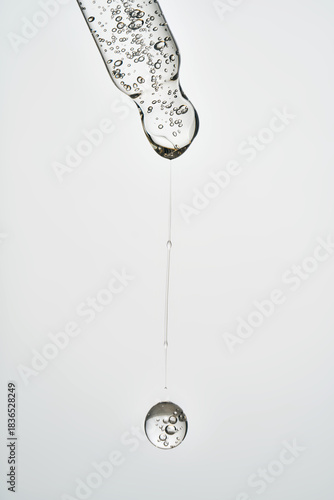 Cosmetic pipette dropping serum with air bubbles