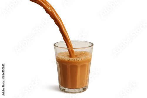 Masala chai pouring into a glass, creating warm beverage splash and froth on transparent background
