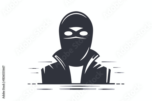 An aggressive hooded character wearing a face mask is operating a dark laptop