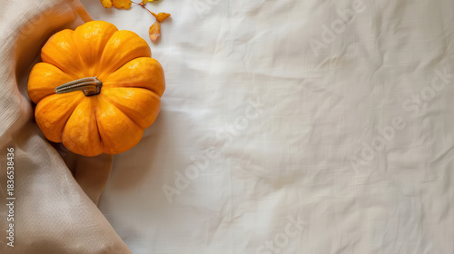 Autumn pumpkins on linen background for festive fall Halloween and thanksgiving design.