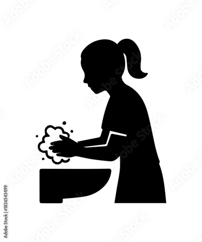 Girl child washing hands with soap for hygiene silhouette
