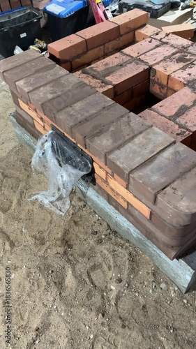 Building a heating stove. Start of work. Vertical video. Wide shot.