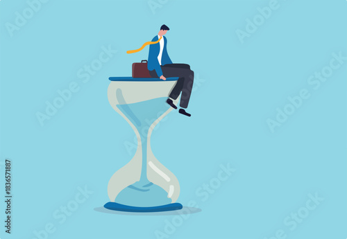 Wasting time waiting and never start new business, time fly or ineffective thinking or laziness concept, depressed businessman sitting on time passing sandglass or hourglass