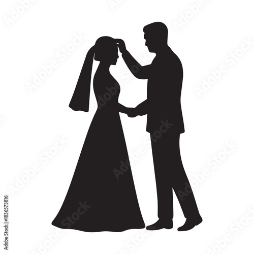 Romantic silhouette of a bride and groom holding hands on their wedding day.