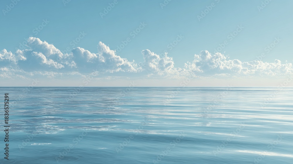 Obraz premium A serene panoramic view of the vast blue ocean under a calm sky with white clouds on the horizon, depicting tranquility and natural beauty.