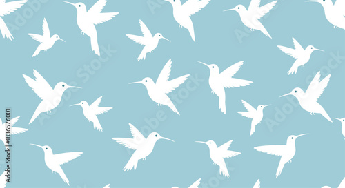 Elegant seamless pattern featuring white hummingbird silhouettes in various flying positions on a calming light blue background.