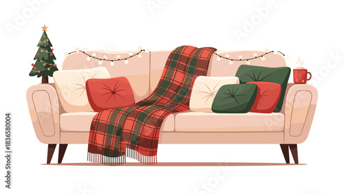Celebrate the holidays with this cozy couch scene featuring a plaid throw, festive pillows and a cute little Christmas tree