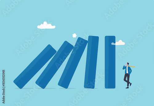 Risk management, uncertainty or unknown threat causing business failure, economic crisis, danger or problem, security and safety concept, courage businessman thinking look at collapsing domino effect.