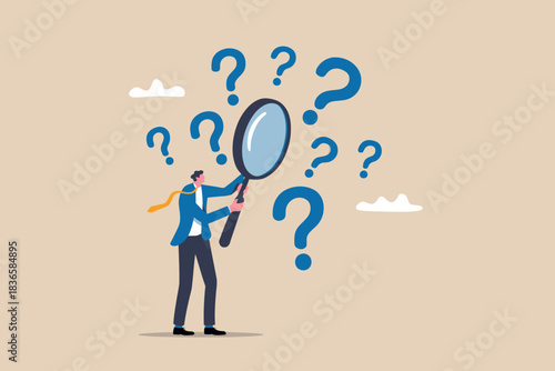 Man with magnifying glass searches for answers among question marks