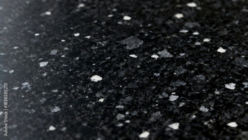 Close-up view of black granite surface with white specks