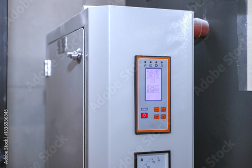 Digital display increases process stability. Annealing - Heat Treatment Furnaces . Industrial furnace with advanced control panel provides precise temperature control in production.