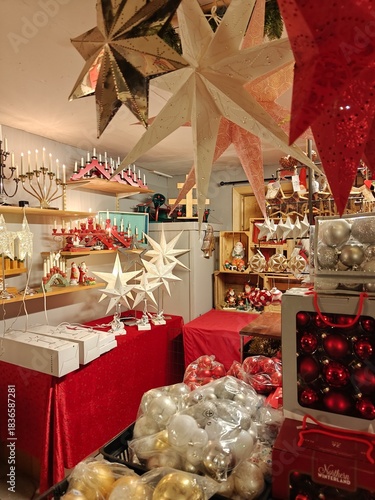 Christmas and New Year decorations in a thrift store, candles, stars, festive ornaments, second-hand holiday decor