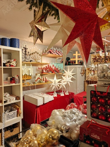 Christmas and New Year decorations in a thrift store, candles, stars, festive ornaments, second-hand holiday decor