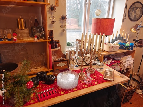 Christmas and New Year decorations in a thrift store, candles, stars, festive ornaments, second-hand holiday decor