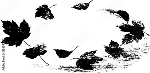 Black and white stencil of autumn leaves drifting in artistic grunge style