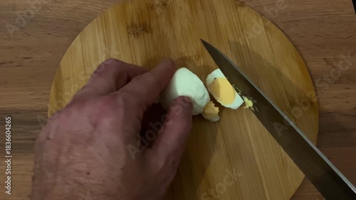 Rustic kitchen scene with egg preparation and natural lighting