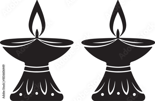 Two lit diya lanterns