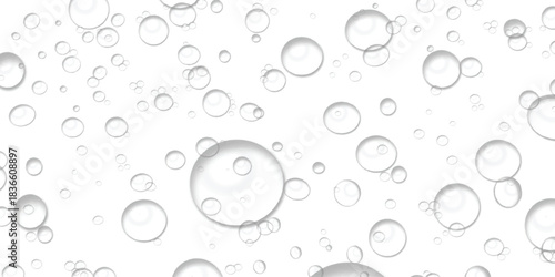 Clear transparent bubbles of various sizes floating on a clean white background