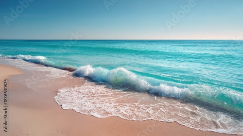 Soft waves glide onto a serene beach capturing the beauty of a peaceful morning by the ocean.