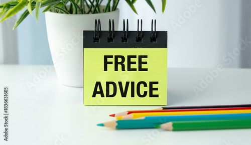 A yellow pad of paper with the word Free Advice written on it