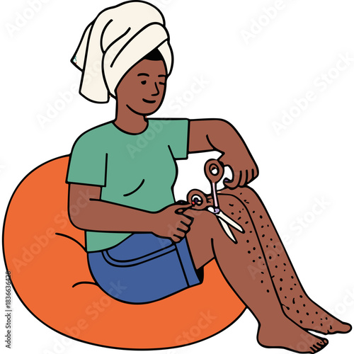 Young Woman With Towel On Head Sitting On Orange Cushion Trimming Leg Hair With Scissors Dressed In Green T Shirt And Blue Denim Shorts With Bare Feet In A Relaxed Pose