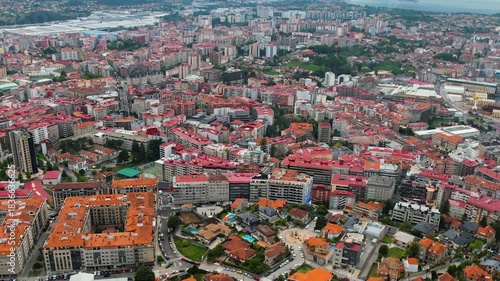 Aerial panorama view around the downtown in the harbor city Vigo in Spain on a cloudy summer afternoon.