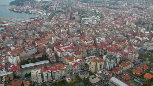 Aerial panorama view around the downtown in the harbor city Vigo in Spain on a cloudy summer afternoon.