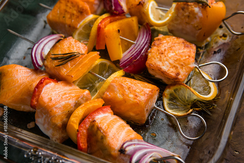 Red fish skewers with vegetables