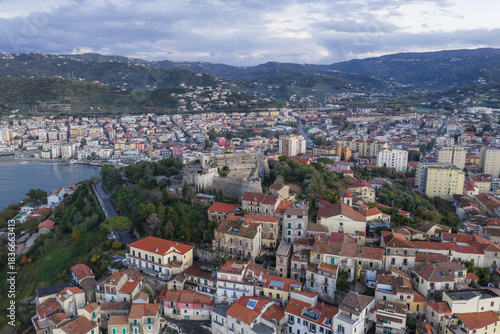 Aerial view of the Castello Aragonese standing majestically atop the hill, overlooking the town and the sea, a blend of history and nature, Agropoli, Campania, Italy.