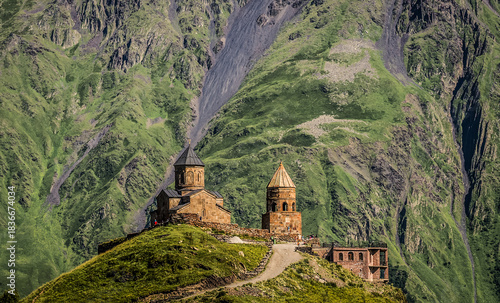 Tsminda Sameba - Trinity Church in Caucasus Mountains in Gergeti village near Stepantsminda in Georgia