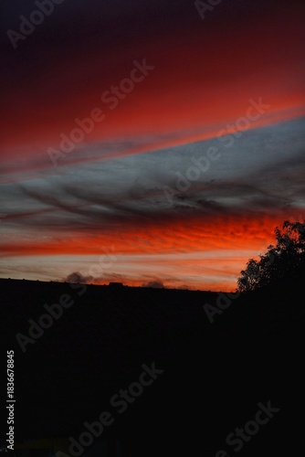 sunset followed by the color of the sky clouds turning red