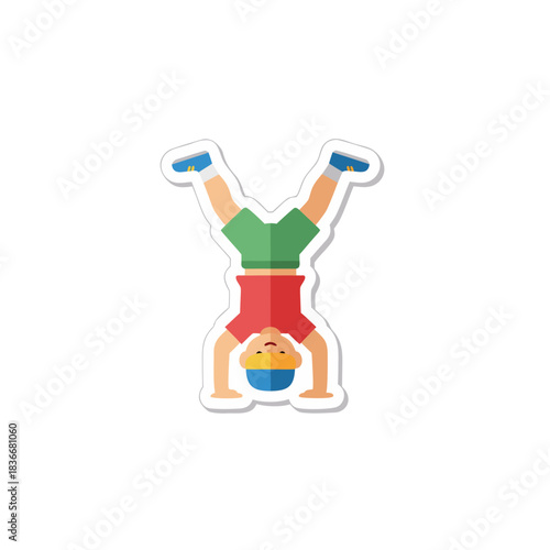 A young boy in a red shirt and green shorts performs a handstand with blue sneakers on a black background with white outline sticker effect