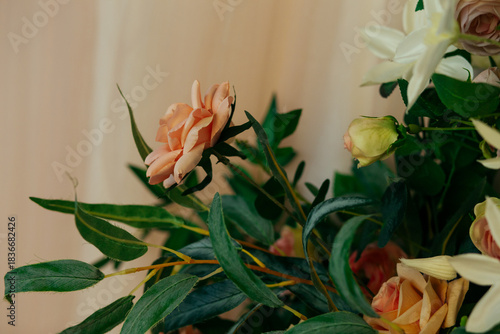 a floral arrangement made of environmentally friendly materials for the interior of a festive event, wedding, or presentation. A photo area with artificial roses
