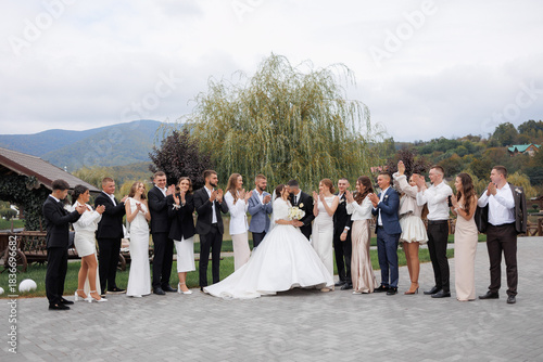 Friends and family gather for joyful wedding celebration in beautiful outdoor venue