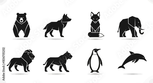 Silhouettes of Wild Animals Including Bear, Wolf, Cat, Elephant, Lion, Dog, Penguin, and Dolphin in Minimalist Black Icons Set