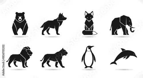 Fototapeta Silhouettes of Wild Animals Including Bear, Wolf, Cat, Elephant, Lion, Dog, Penguin, and Dolphin in Minimalist Black Icons Set