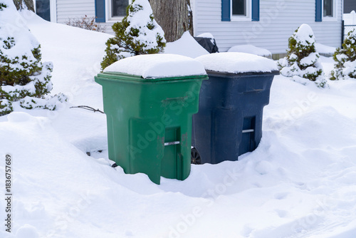trash bin outdoor in winter blizzard in snow