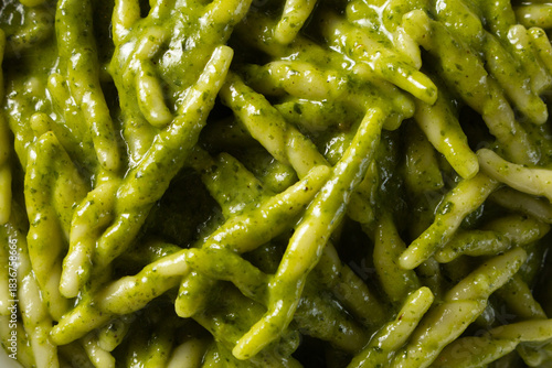 Tableau sur toile A top down view of a pile of trofie pesto pasta, as a background.