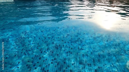 Wallpaper Mural Swimming Pool Water Rippling in Sunlight with Blue Tiles in Bright Outdoor Setting Torontodigital.ca